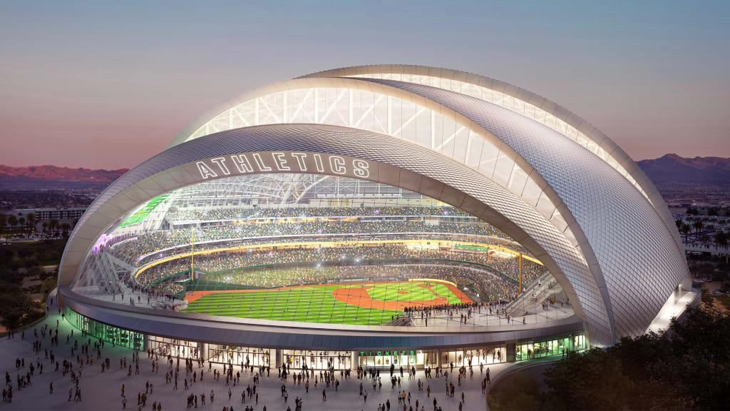 A rendering of a modern baseball stadium featuring the name 'Athletics' prominently displayed on the roof, with a crowd attending an evening game and mountains visible in the background.